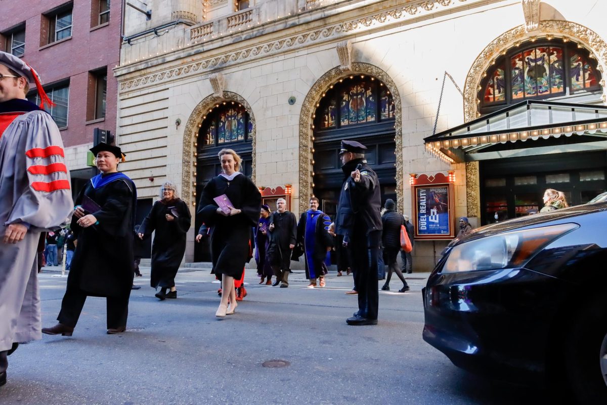 Emerson faculty process outside the Cutler Majestic Theater at the conclusion of the presidential Inauguration. 