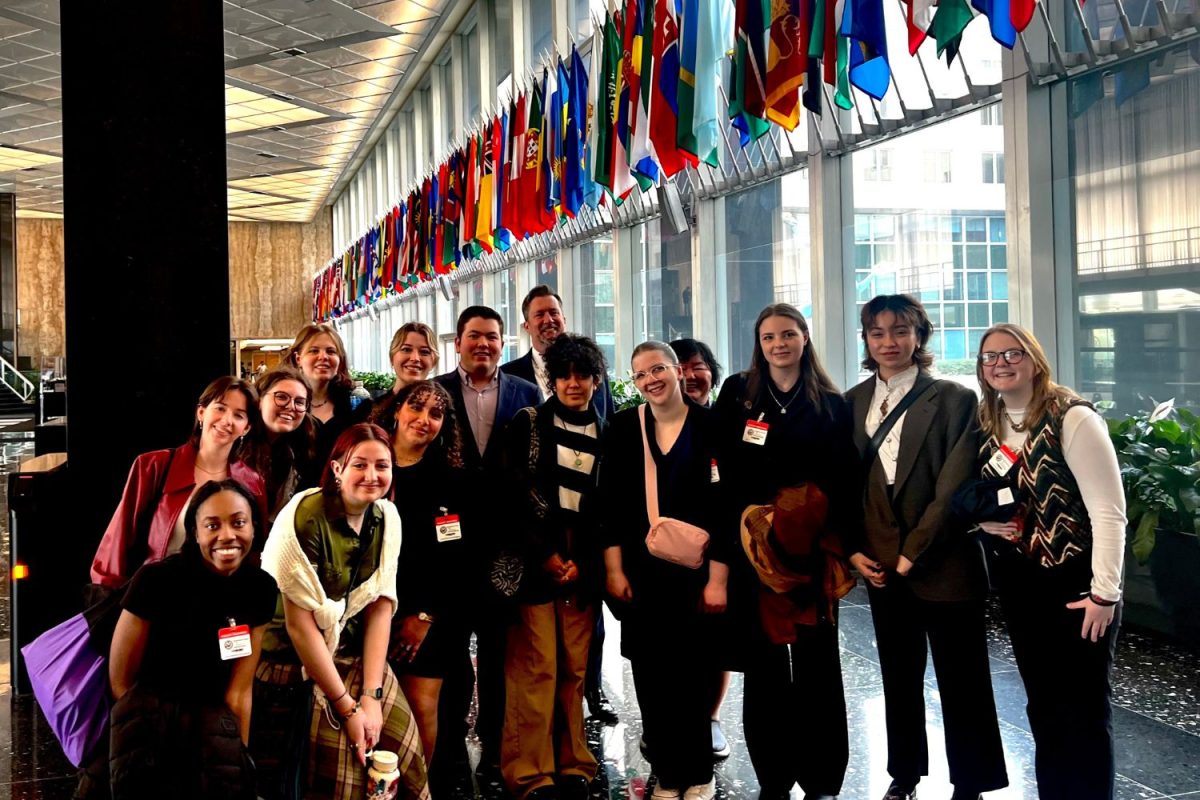 CPLA members during a tour of the State Department in front of the Wall of Flags. (Photo courtesy of Gregory Payne)