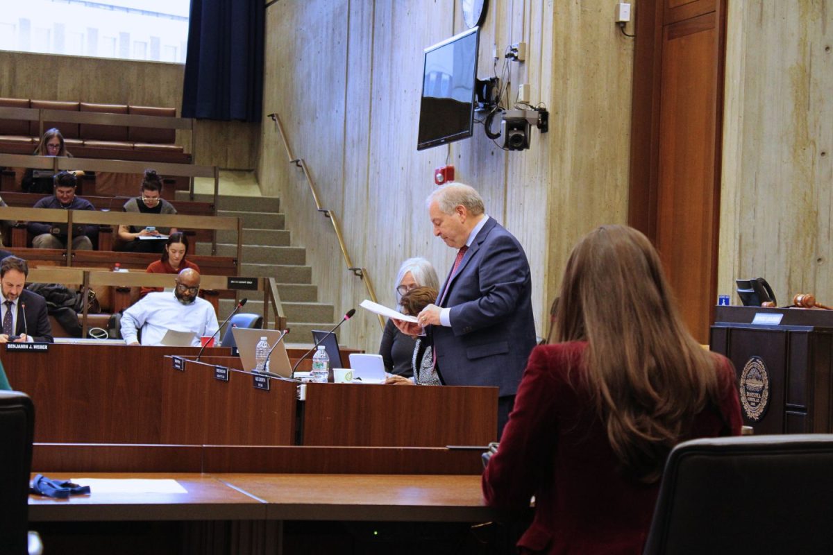 Boston City Clerk Alex Geourntas reads aloud a docket at the councils weekly meeting held on Wednesday, April 10 in the Christopher Iannella Chamber at Boston City Hall. (DJ Mara/Beacon Staff)