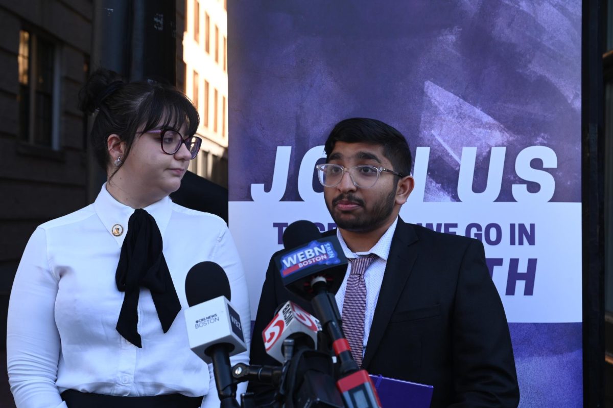 SGA Executive President Charlize Silvestrino, left, and Executive President-elect Nandan Nair, right, speak at a press conference outside the 2 Boylston Place alley ahead of a vote of no confidence tomorrow. (Mariyam Quaisar/Beacon Staff)