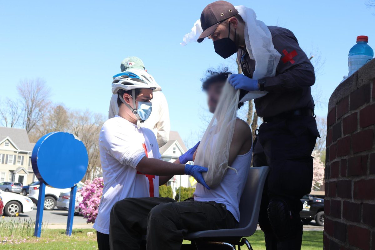 A protestor is given medical attention for head, shoulder, and arm injuries on Thursday, April 25, 2024. Medical personnel volunteers say the head injury will require ER attention. (Bryan Hecht/Beacon Staff)