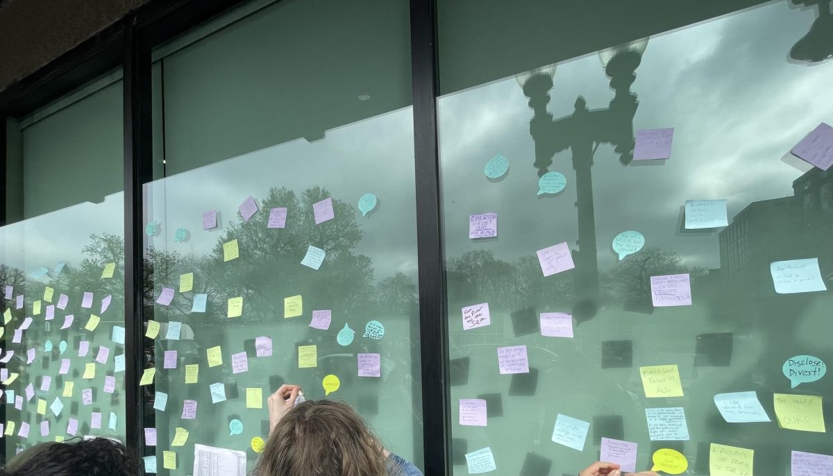 Sticky notes on wall of Ansin Building put up by protesters on Wednesday, May 1, 2024. (Rian Nelson/Beacon Staff)
