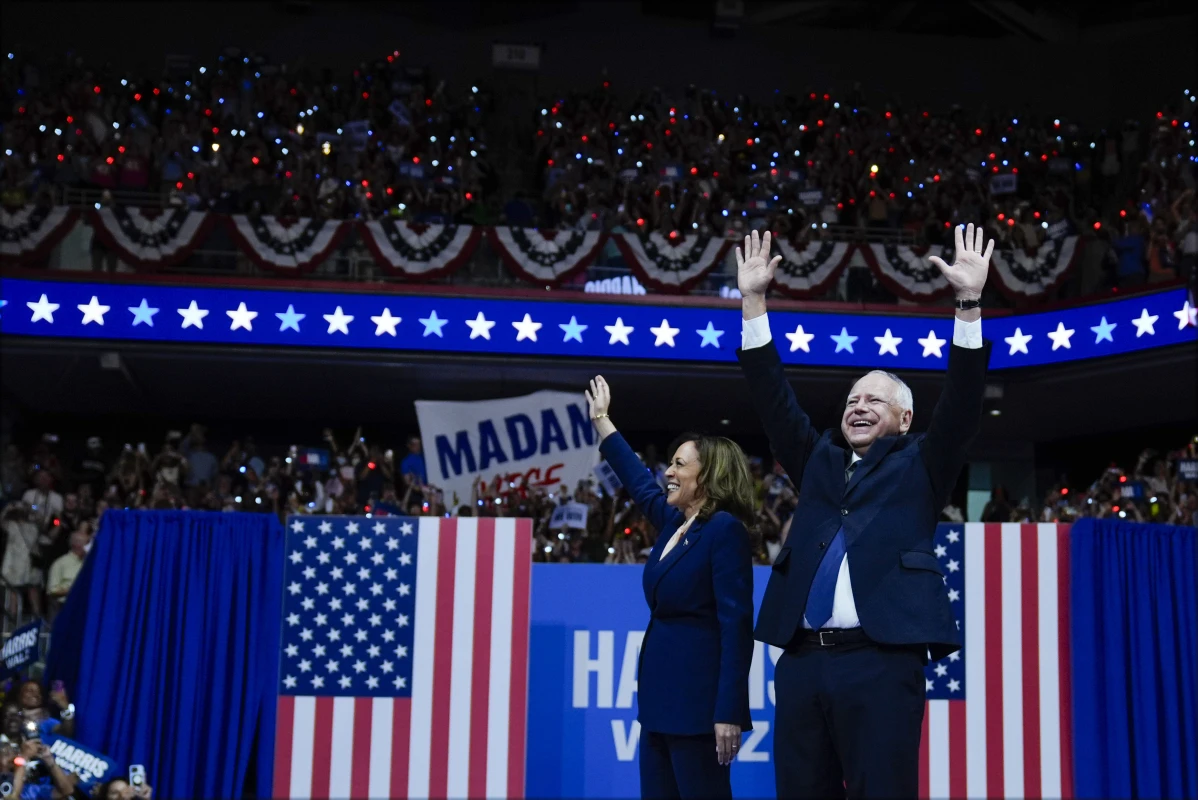 Democratic presidential nominee Vice President Kamala Harris and her running mate Minnesota Gov. Tim Walz arrive at a campaign rally in Philadelphia, Tuesday, Aug. 6, 2024. (AP Photo/Matt Rourke)