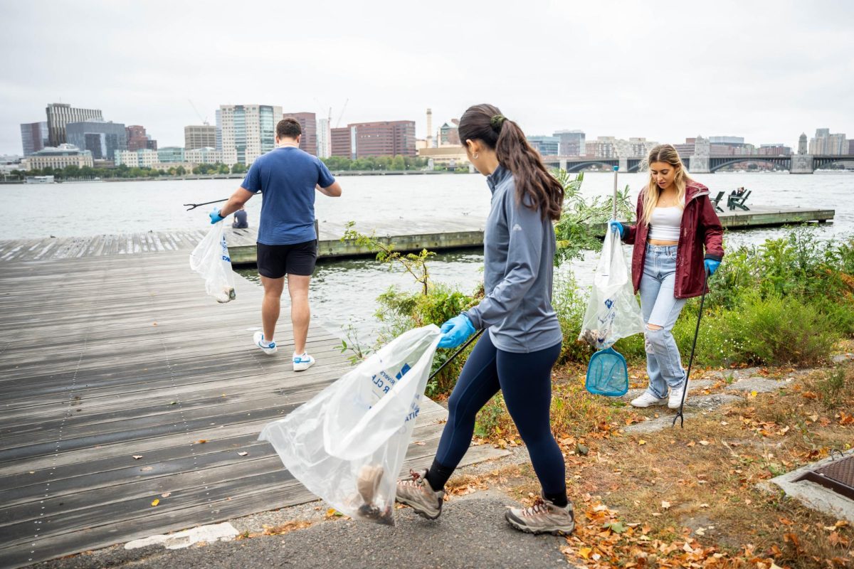 A group of volunteers from Emerson Green Collective (EGC) and Emerson Sustainability cleans the esplanade on Friday, Sept. 20.  (Yogev Toby/ Beacon Correspondent)