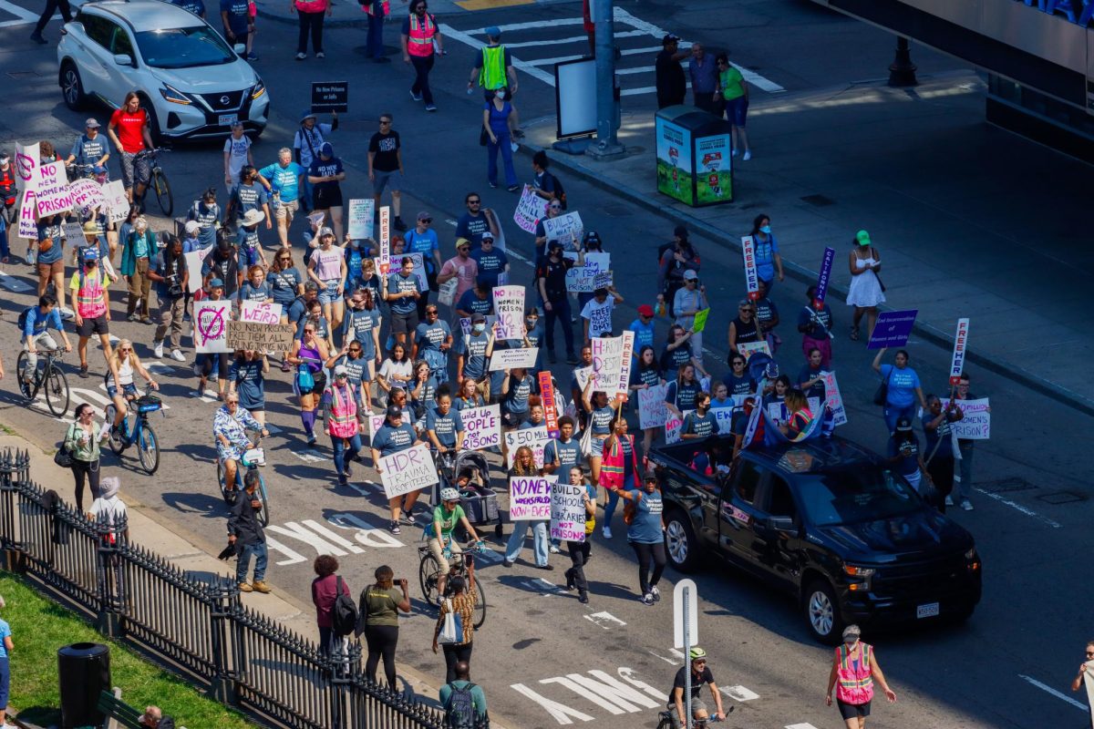 FreeHer protesters march down Tremont St on Saturday, Sept. 14. (Arthur Mansavage/ Beacon Staff)