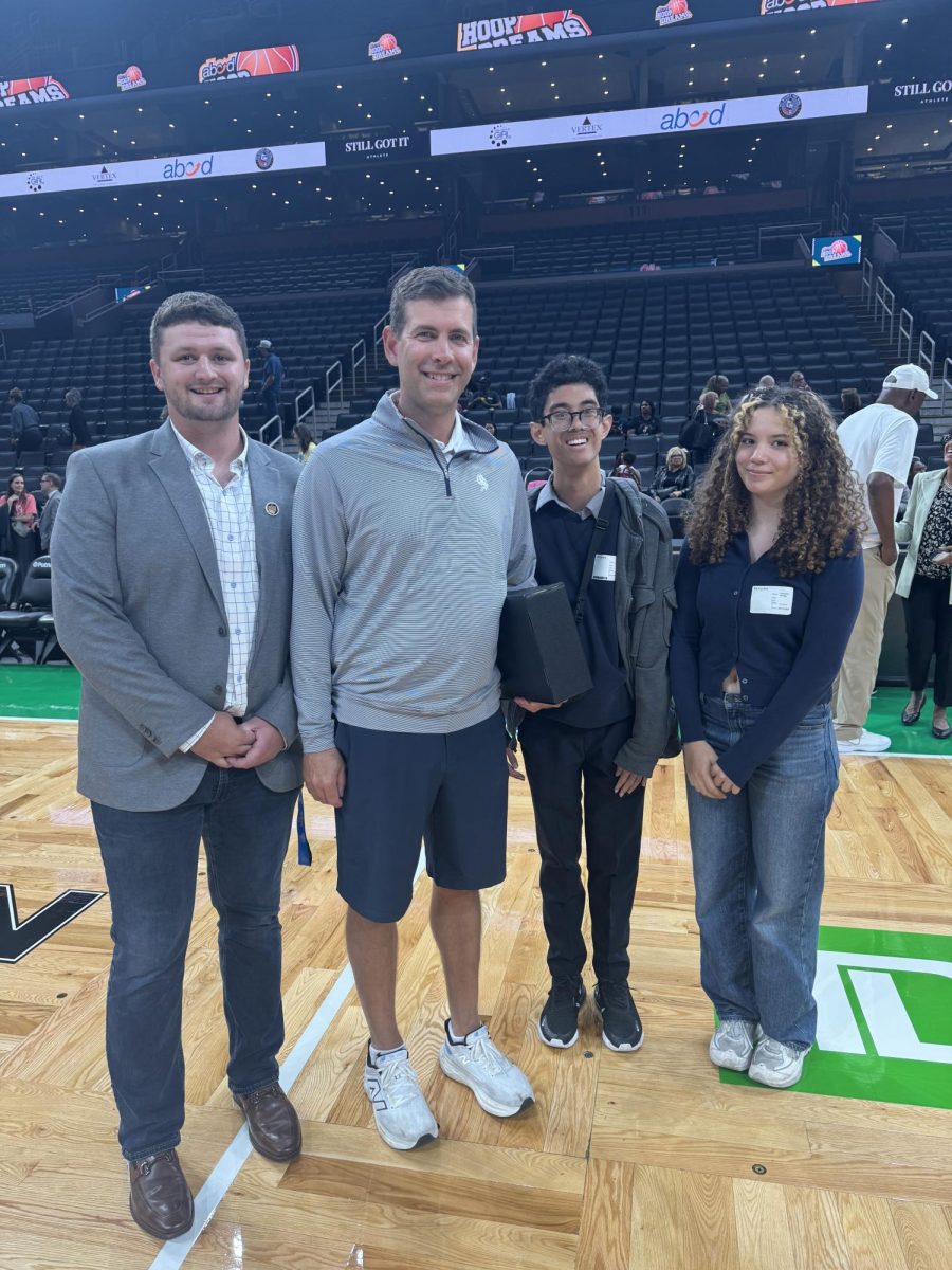 Celtics General Manager Brad Stevens poses with Emerson students Bryson Akins (left), Jordan Pagkalinawan (second from right) and Samantha Otridge (right).