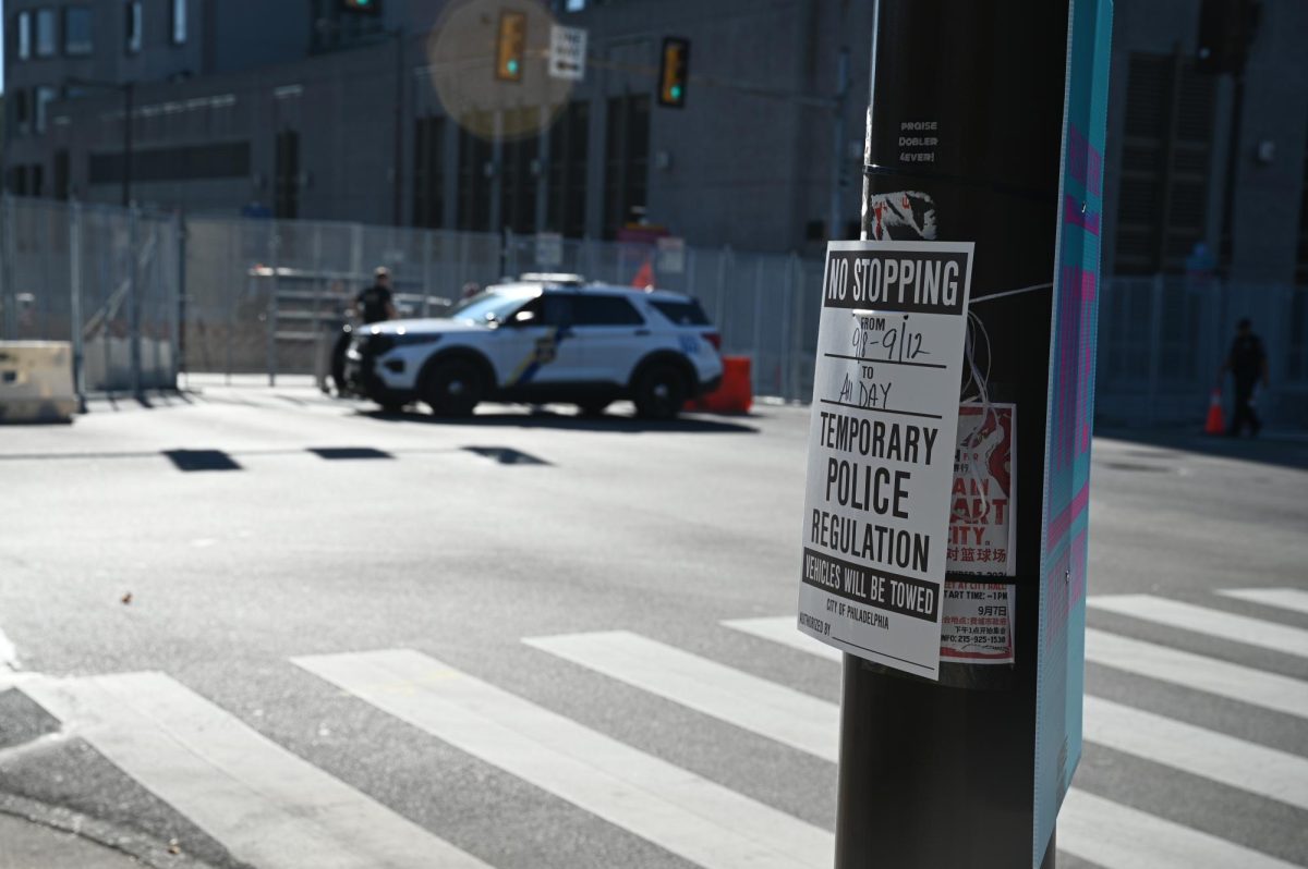 A towing notice on a telephone pole in downtown Philadelphia advertising road closures and traffic regulations for the presidential debate on September 10, 2024 (Bryan Hecht / Beacon Staff).