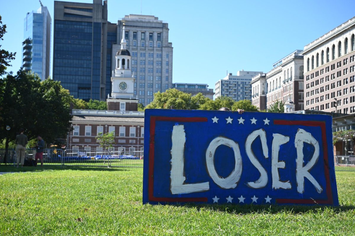 Artist Tim Smith's canvas in Independence Mall, expressing his disdain for former President Donald Trump ahead of the presidential debate in Philadelphia on September 10, 2024 (Bryan Hecht / Beacon Staff).