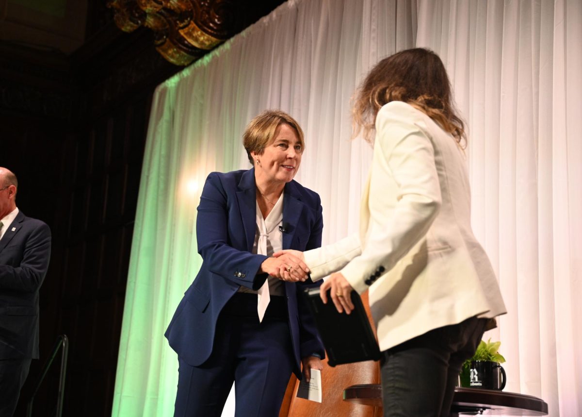 Massachusetts Governor Maura Healey shakes hands with moderator and Globe climate reporter Sabrina Shankman at the conclusion of Thursday's panel discussion on building the climate workforce at Day 2 of the Boston Globe Summit on September 26, 2024 (Bryan Hecht / Beacon Staff).