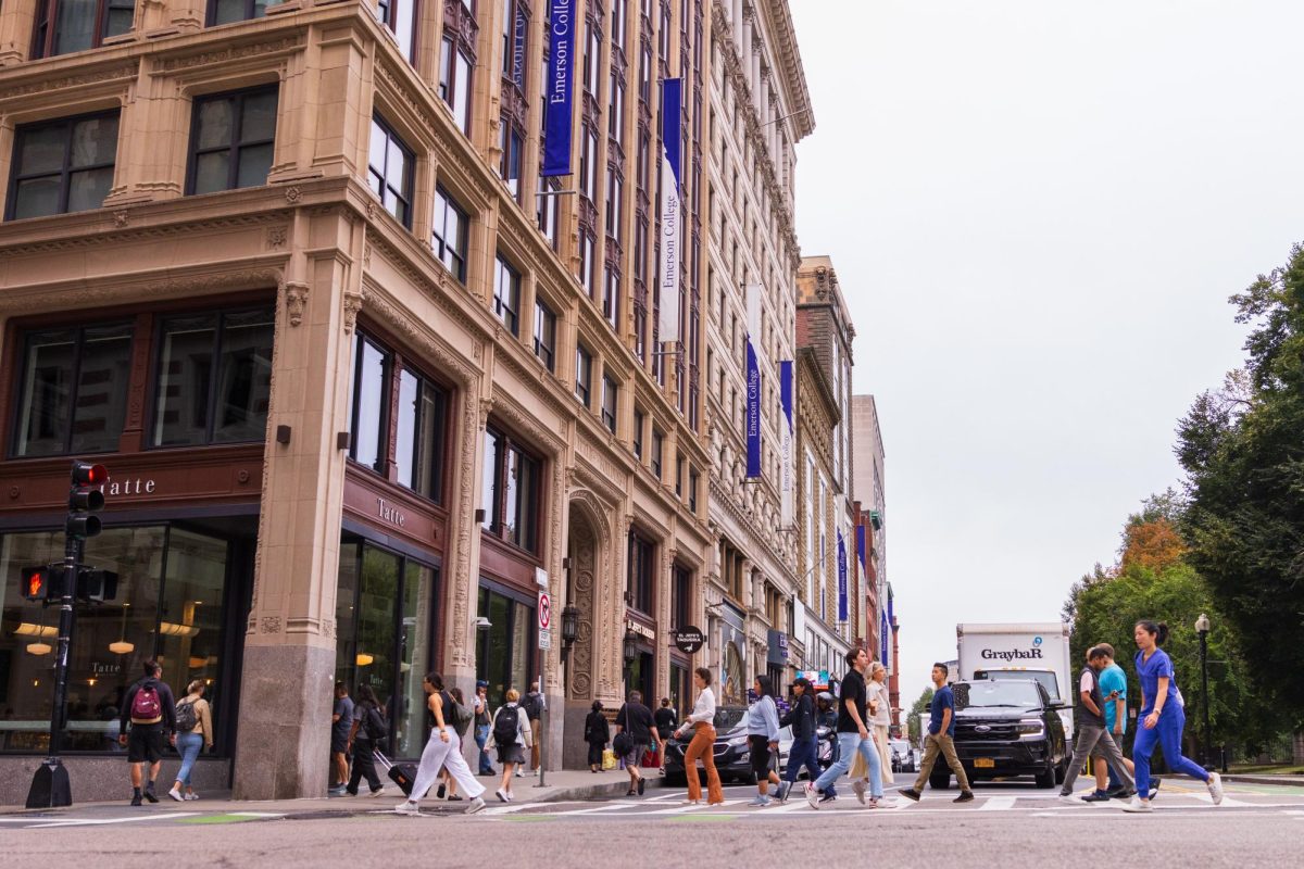People crossing the street outside the Little Building at the corner of Boylston and Tremont streets. (Arthur Mansavage/ Beacon Staff, File) 