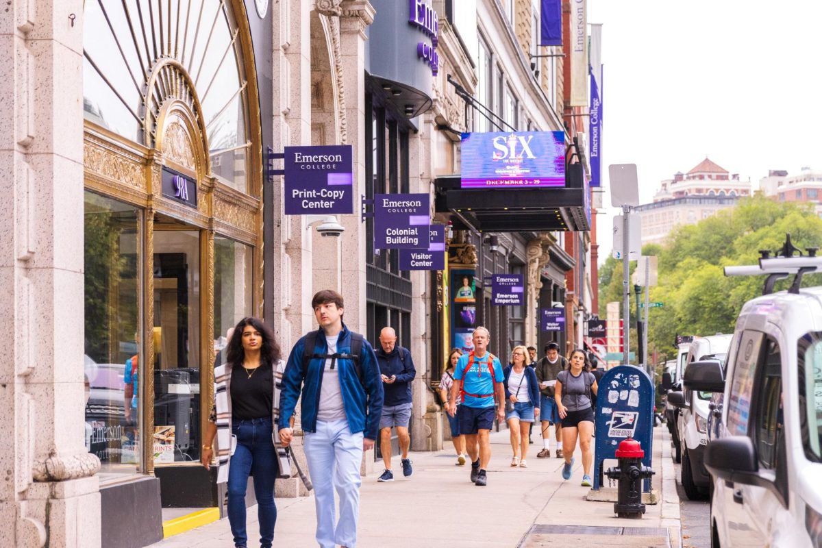 People walking past Emerson College buildings on Boylston Street. (Arthur Mansavage/ Beacon Staff, File) 