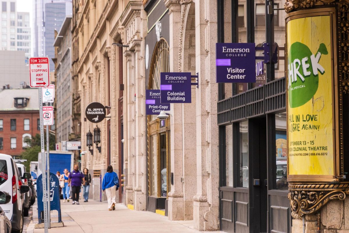 People walking past Emerson College buildings on Boylston Street. (Arthur Mansavage/ Beacon Staff, File) 