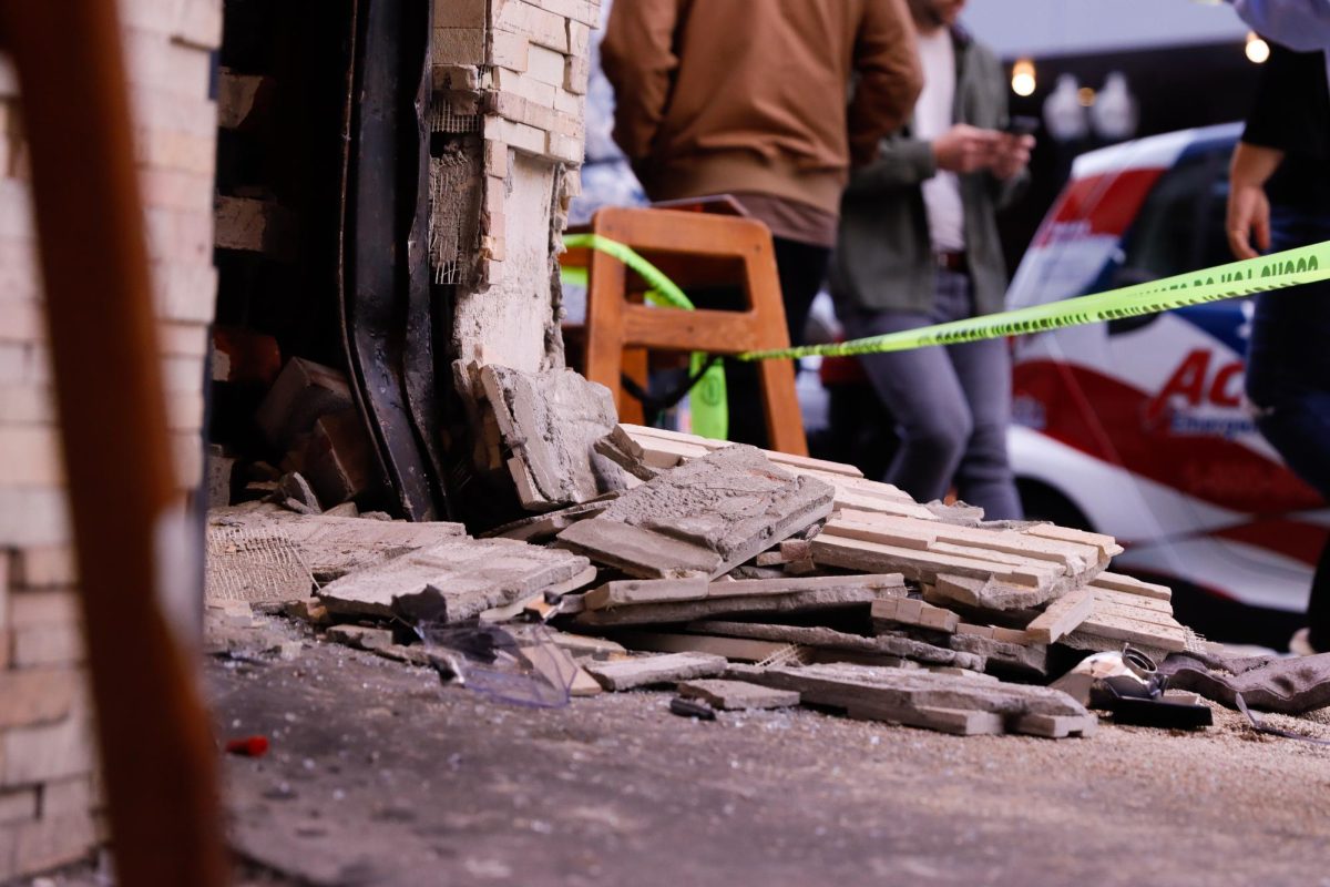 The Boston Inspectional Services Department responded to the scene to evaluate the building. The crash damaged the restaurant's front door. (Arthur Mansavage / Beacon Staff)