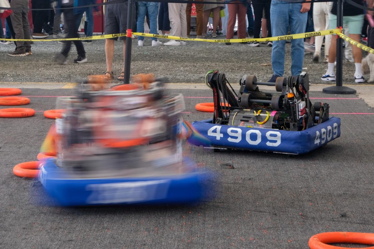 Bots built by highschool robotics teams battle in RoboBoston’s makeshift arena in Seaport Boulevard on September 28, 2024. (Julianna Jemima Badajos/ Beacon Correspondent)