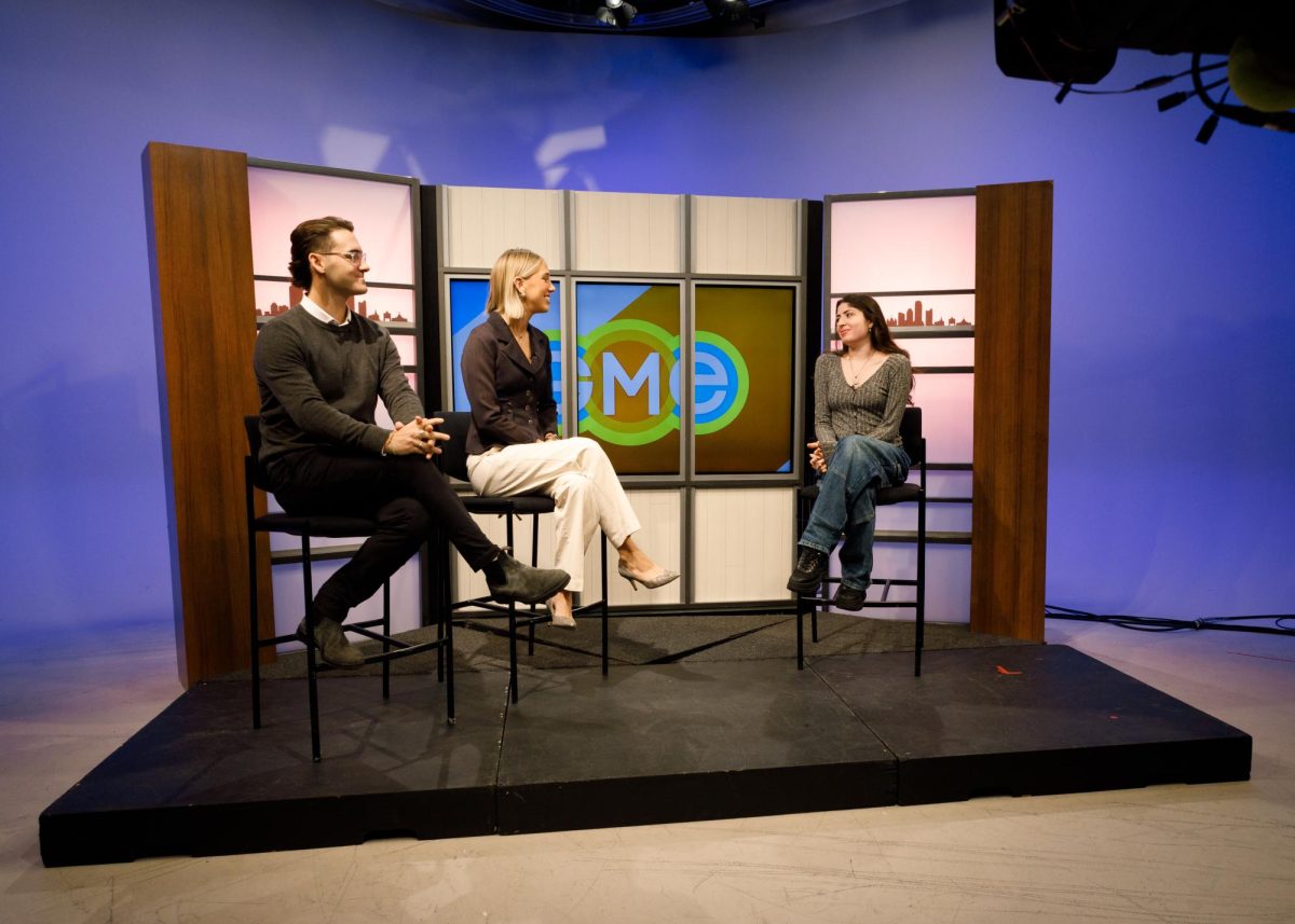  Good Morning Emerson Hosts Max Lasky (left) and Faith Pinnow (middle) interview one of the Co-Presidents of Emertainment Monthly, Emily Zeitz (right) live on the air. GME conducts an interview during most of their shows along with covering events around the city, and delivering news stories to their viewers. (Madla Walsh/ Beacon Staff)