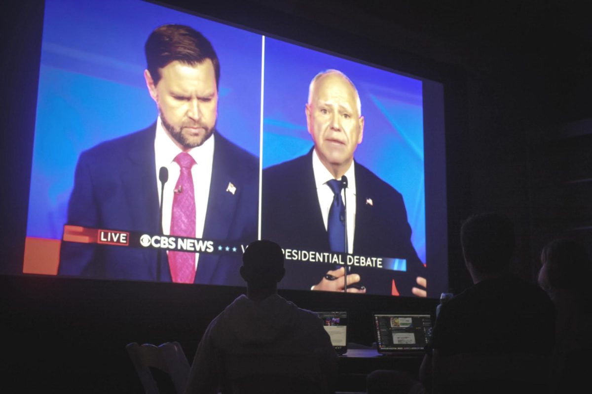 Students watch the first and likely only vice presidential debate of the 2024 election between Ohio Sen. JD Vance and Minnesota Gov. Tim Walz in the Bill Bordy Theater on October 1, 2024 (Abigail Hoyt / Beacon Correspondent). 