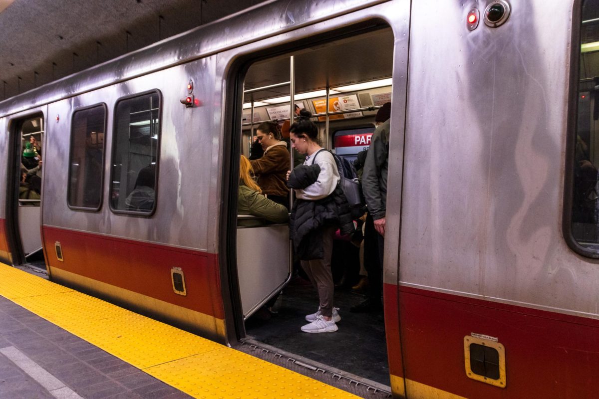 People waiting on a redline subway car in the Park Street Station on March 21, 2023. (Arthur Mansavage/ Beacon Staff, File) 