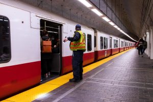 A MBTA worker inspects a redline subway car in the Park Street Station on March 21, 2023. (Arthur Mansavage/ Beacon Staff, File)