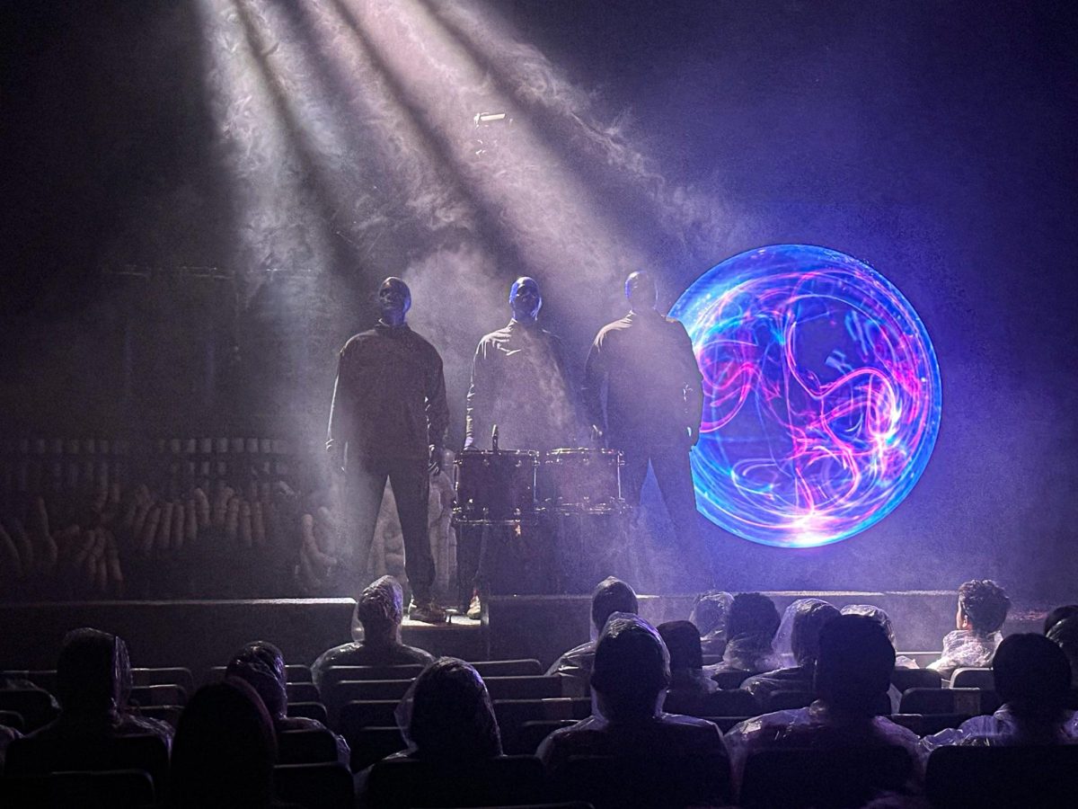 The Blue Man group onstage during a performance at the Charles Playhouse in downtown Boston, where they have had a residency since 1995, on Oct. 17, 2024 (Nick Peace / For the Beacon).