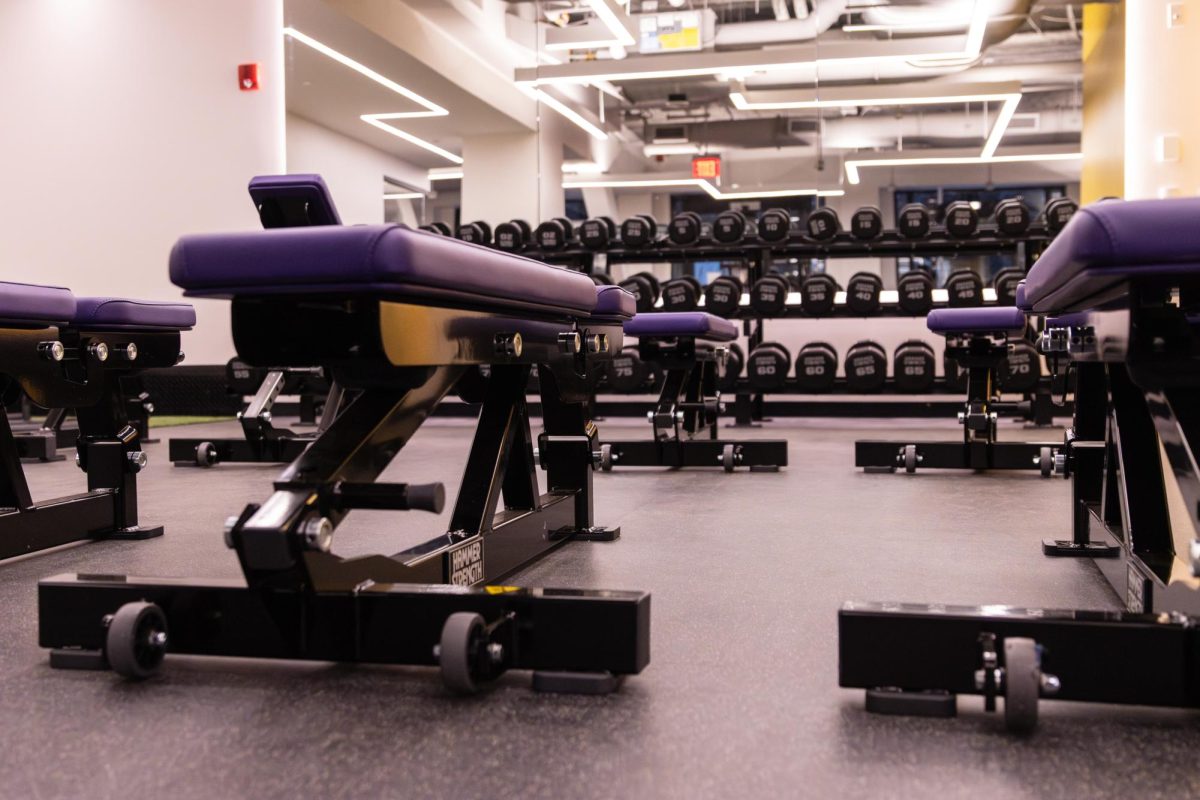 Part of the fitness center update included an increase in the number of free weights and weight training machines like two weight rooms and more dumbbells. (Arthur Mansavage/ Beacon Staff)