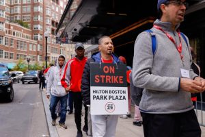 Hotel works from the Park Plaza Hotel walking the picket line with signs that read” On Strike, Hilton Boston Park Plaza” on October 6, 2024. (Arthur Mansavage/ Beacon Staff)