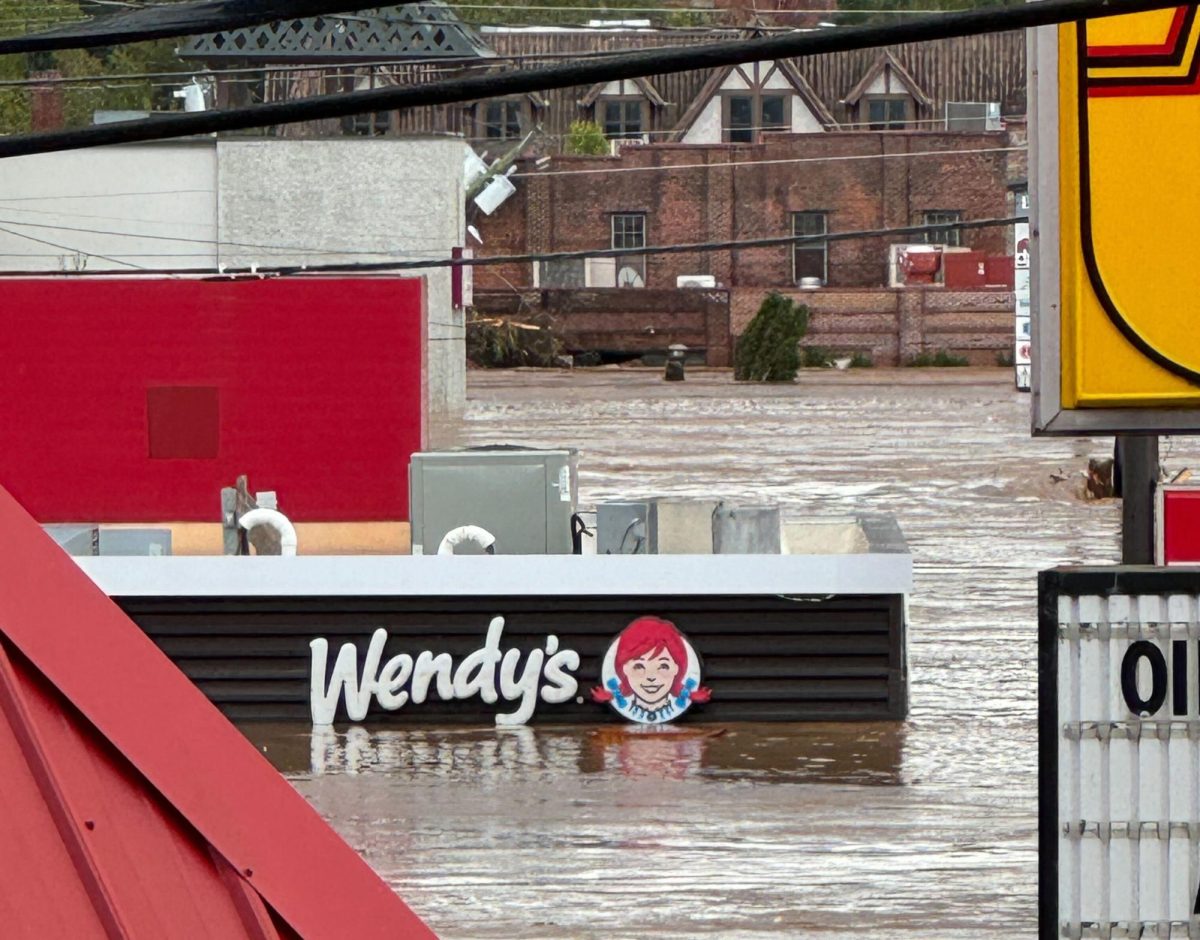 Flooding reaches almost to the roof of a Wendy's restaurant in Asheville, NC, as the town is rocked by Hurricane Helene (Andrew Price / Courtesy).