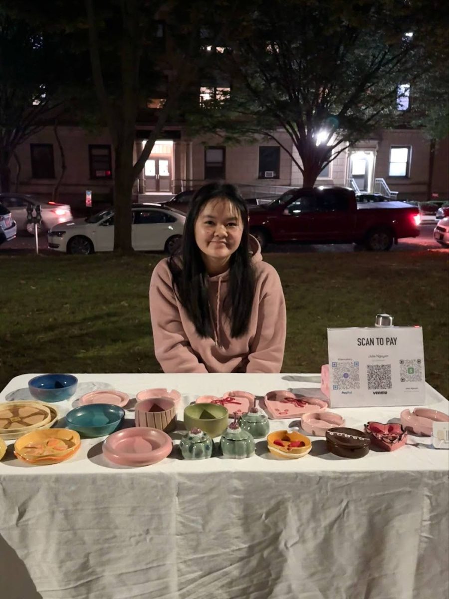 Senior Film Student, Julie Nguyen, at her ceramics stand. (Elisa Ligero / Beacon Correspondent)