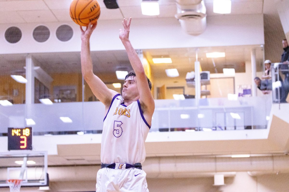 Graduate guard Trevor Arico shoots against Salem State University (Arthur Mansavage/ Beacon Staff, File)