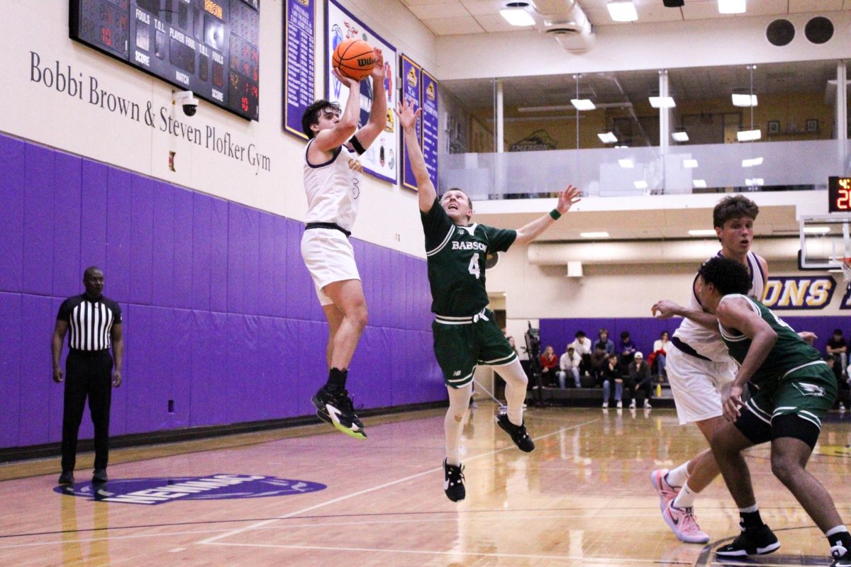 Graduate guard Trevor Arico (#5) rises up for a jump shot against the Babson Beavers on Wednesday, Dec. 4 (Riley Goldman/ Beacon Staff)