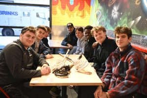 Emerson men's lacrosse players in Dave's Hot Chicken (Merritt Hughes / Beacon Staff)

Left to right: Jacob Goldberg (freshman), Jack Burns (senior), Ethan Corby (junior), Owen Lotti (junior), Brady Fish (freshman), Grant Wilson (senior), Quinn Gardiner (sophomore), Landon Segal (sophomore)