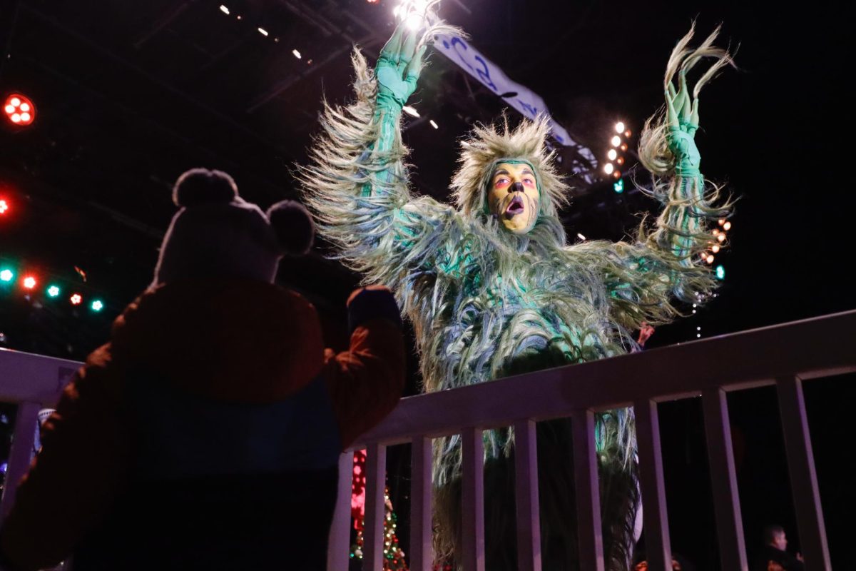 The Grinch dancing to the crowd during the tree lighting event in the Boston Common on Thursday, Dec. 5, 2024. (Arthur Mansavage/ Beacon Staff)