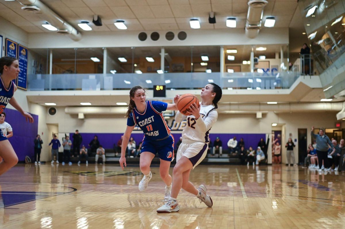 Junior guard Bri Frongillo (#12) swished the game-winning floater with 0.6 seconds left against Coast Guard on Jan. 25, 2025 (Courtesy of Anna Schoenmann).