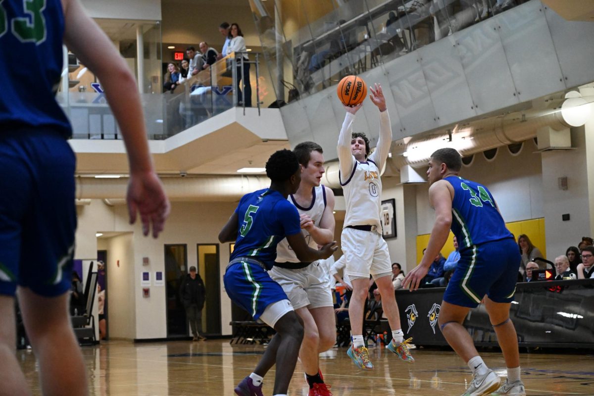 Senior guard Lucas Brenner shoots a three-pointer against the Salve Regina Seahawks on Jan. 23, 2025 (Riley Goldman/ Beacon Staff).