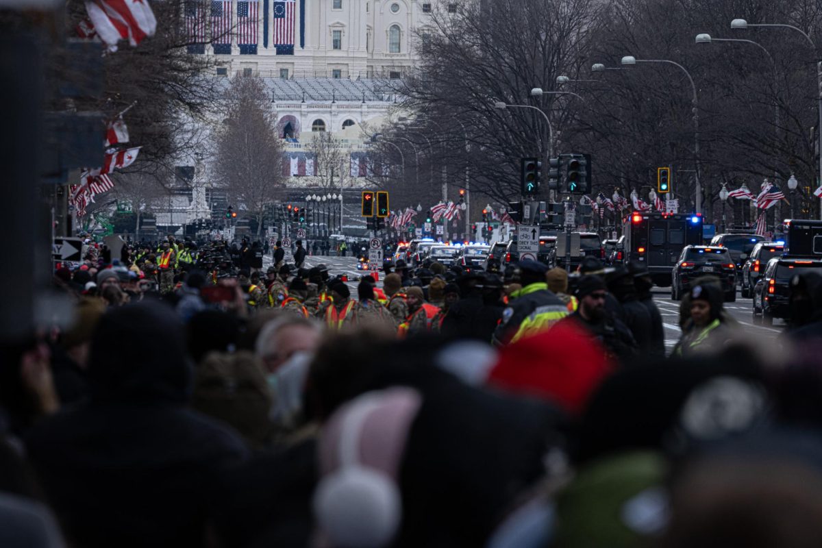 The president's motorcade passes crowds of trump supporters in front of the capitol building on Monday, Jan. 20, 2025. (Nick Peace/ Beacon Staff)