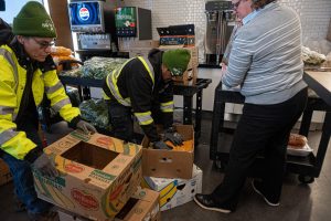 Food For Free workers organize the Emerson dining hall donation alongside Bon Appetit District Manager Dawn Sajdyk on Wednesday, Dec. 18, 2024.