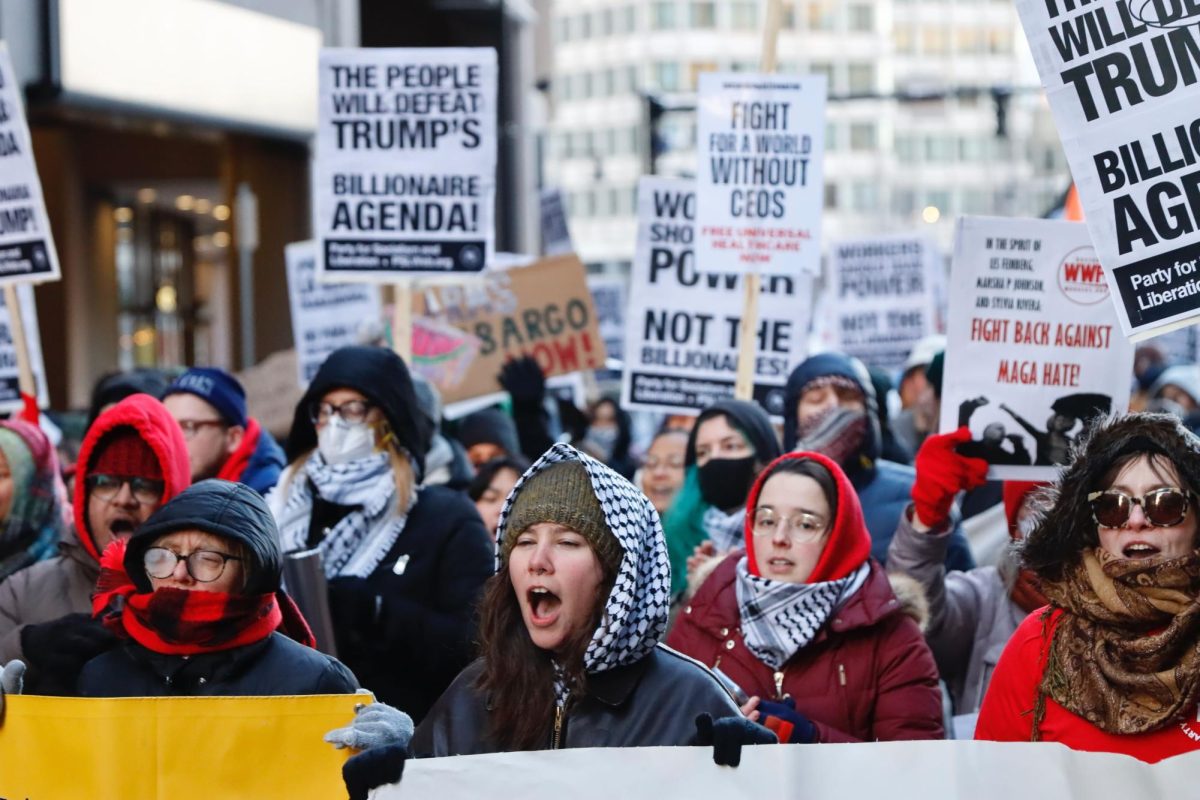 The Boston chapter of the Party for Socialism and Liberation (PSL) holds a rally against the Trump administration outside the JFK Federal Building Monday afternoon. (Arthur Mansavage/ Beacon Staff)