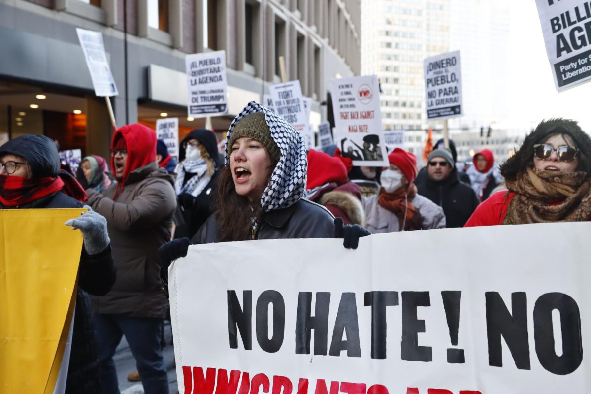 The Boston chapter of the Party for Socialism and Liberation (PSL) holds a rally against the Trump administration outside the JFK Federal Building Monday afternoon. (Arthur Mansavage/ Beacon Staff)