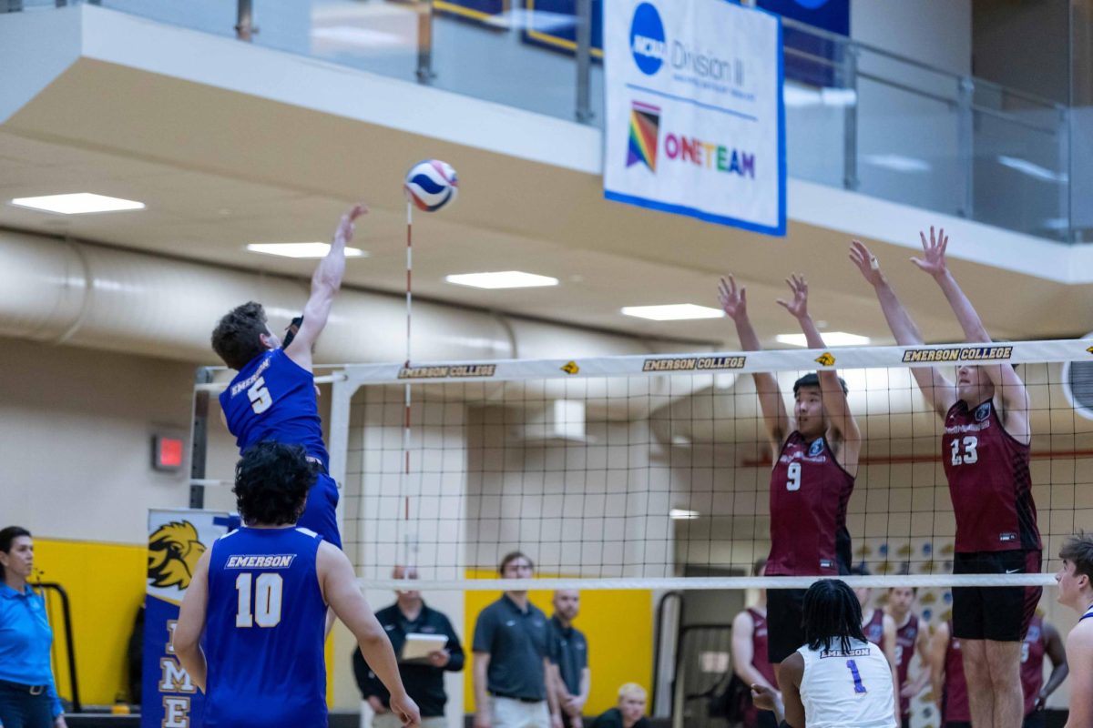 Junior outside hitter Chase Fagen (#5) elevates for an attack against MIT on Jan. 28, 2025 (Rian Nelson/ Beacon Staff).