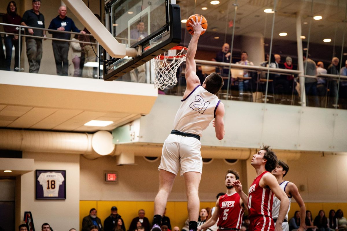 Senior center Asher Gardiner (#21) elevates for a slam dunk against WPI on Saturday, Jan. 11, 2025 (Courtesy of Nate Gardner).