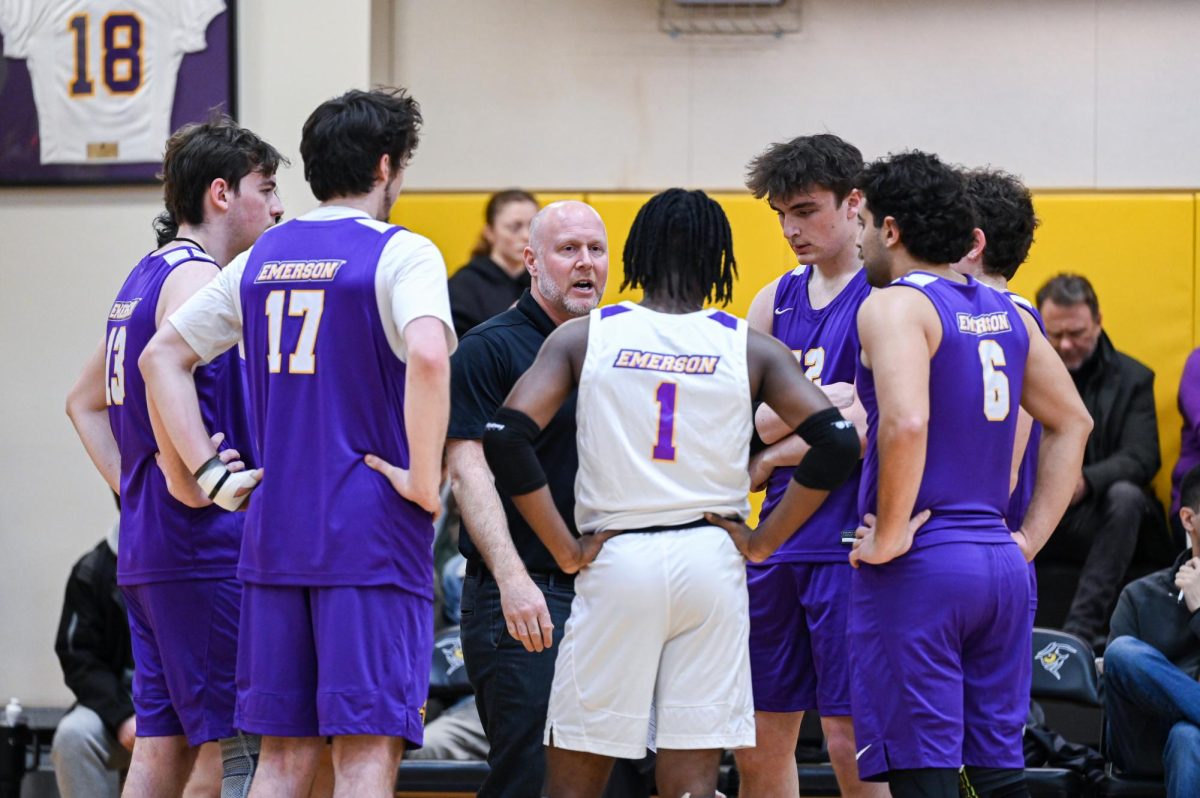 Men's volleyball head coach Ben Read huddles with his team against Endicott (Courtesy of Anna Schoenmann/ Beacon Archives).