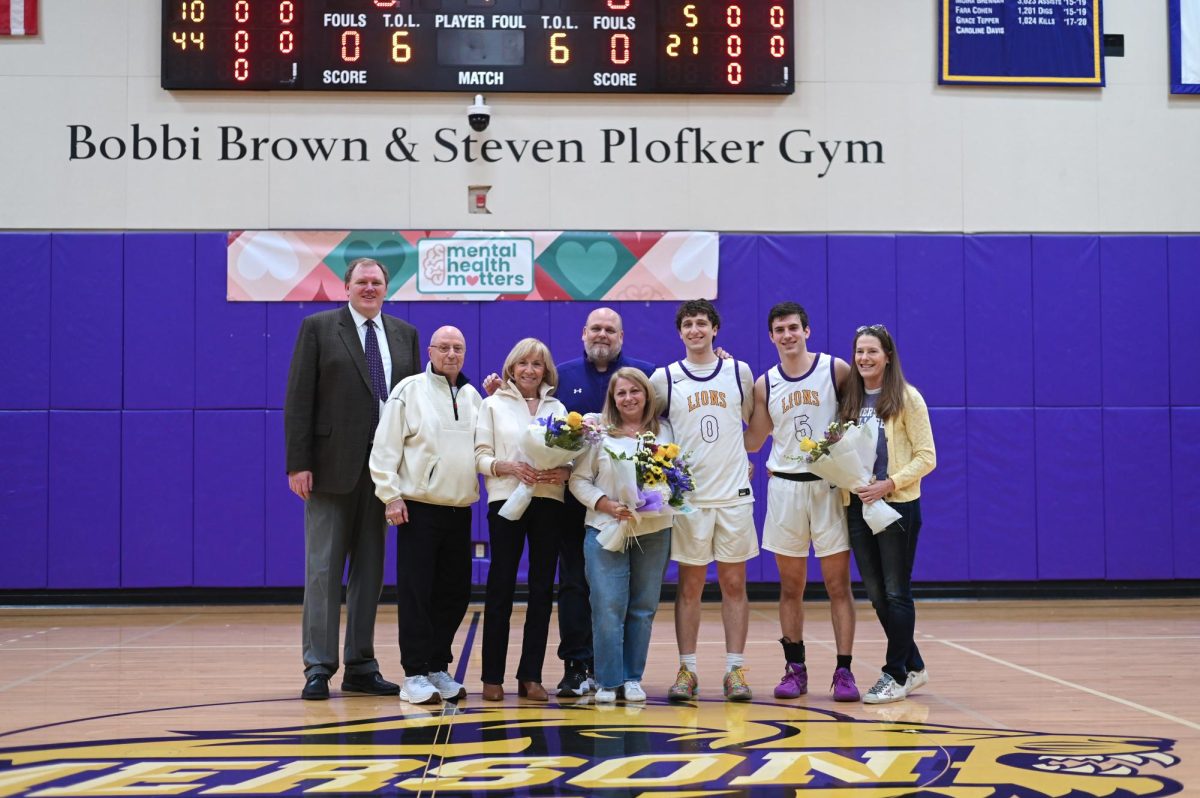 The Emerson men's basketball team honored senior guard Lucas Brenner (#0) and graduate guard Trevor Arico (#5) in a pregame ceremony against Wheaton on Feb. 19, 2025 (Courtesy of Anna Schoenmann).