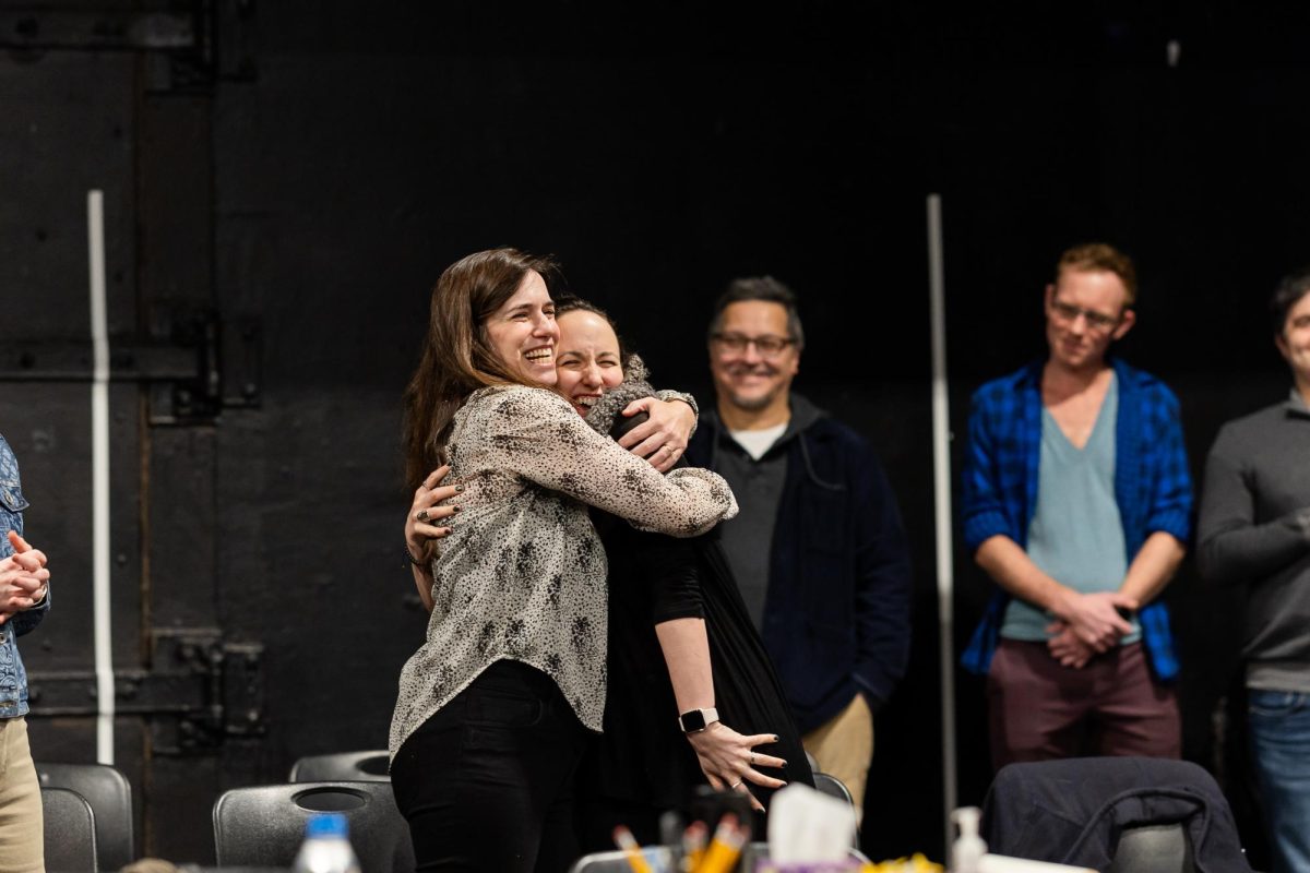 Playwright Kate Hamill and Director Shana Cooper hug during a workshop of "The Odyssey." (Bryan Liu/ For The Beacon)