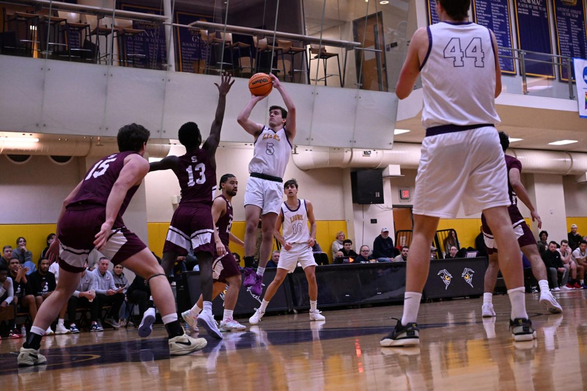 Graduate guard Trevor Arico shoots against Springfield College on Feb. 15, 2025 (Riley Goldman/ Beacon Staff).