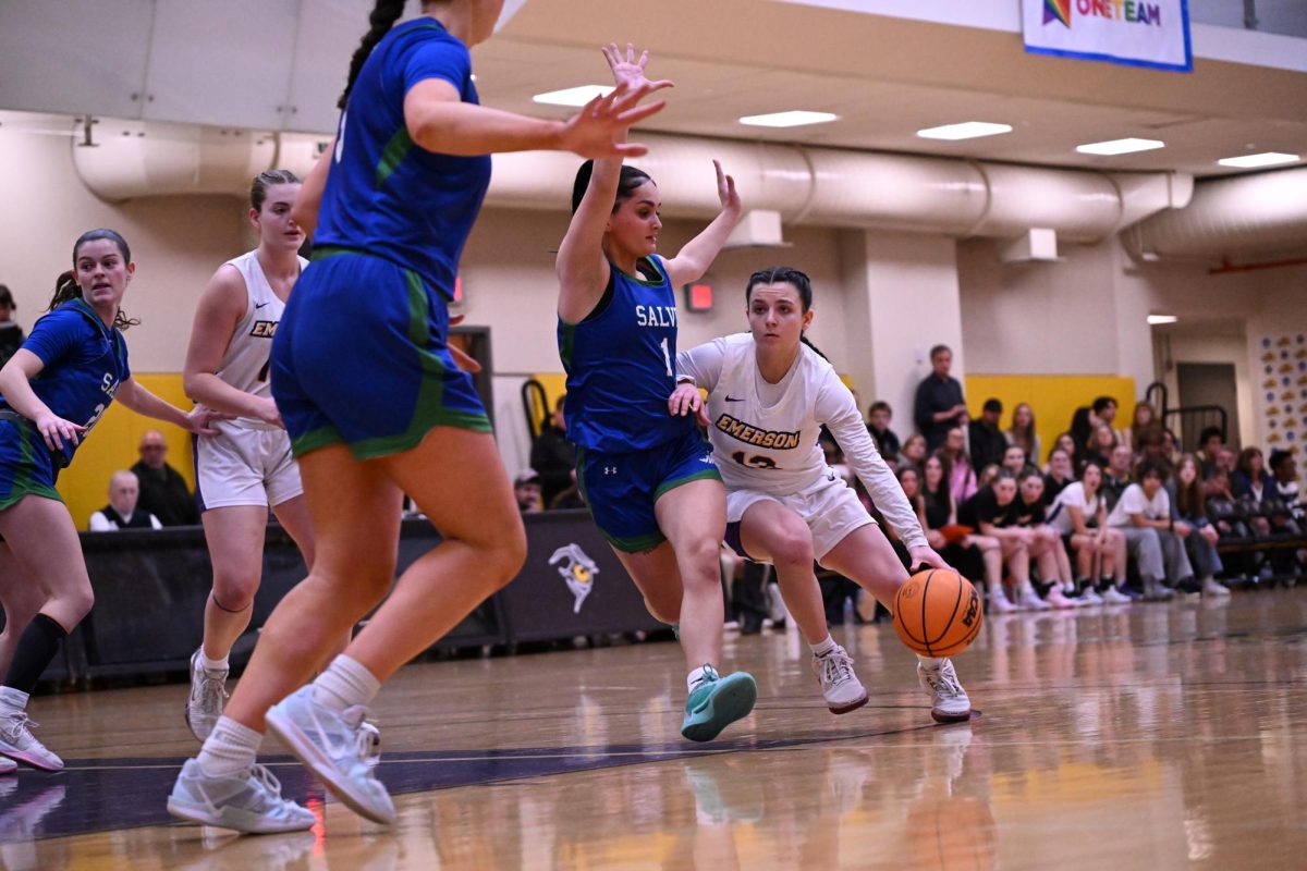 Junior guard Bri Frongillo drives against the Salve Regina Seahawks in the NEWMAC Quarterfinals on Feb. 26, 2025. (Riley Goldman/ Beacon Staff)