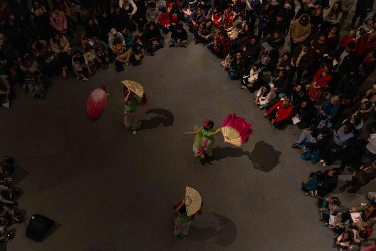 Dancers perform a “Lotus Dance”, which originates from 1600’s Vietnam. The Lotus flower in Vietnamese culture symbolizes purity, commitment and optimism for the future on Jan. 30, 2025. (Rian Nelson/ Beacon Staff)