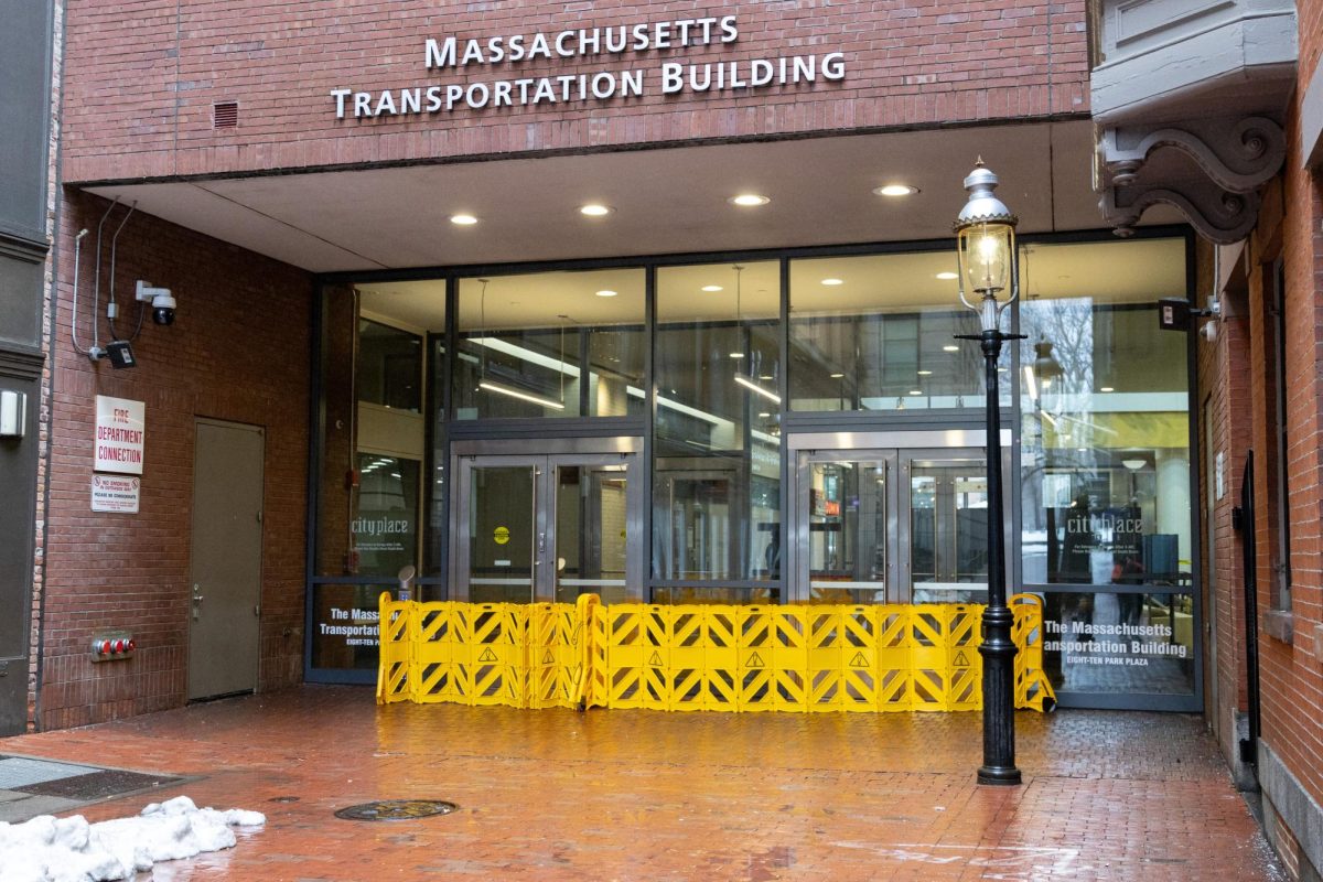 Yellow caution barriers block the entrance to the Massachusetts Transportation Building in the 2 Boylston Place alley on Thursday Feb. 13, 2025. ECPD sent a community advisory telling students and staff to stay away from the area. (Arthur Mansavage/ Beacon Staff)