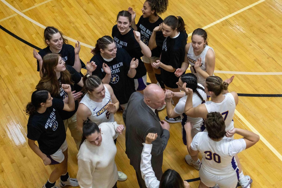 The Emerson women's basketball team huddles up before facing the WPI Engineers on Feb. 12, 2025 (Rian Nelson/ Beacon Staff).