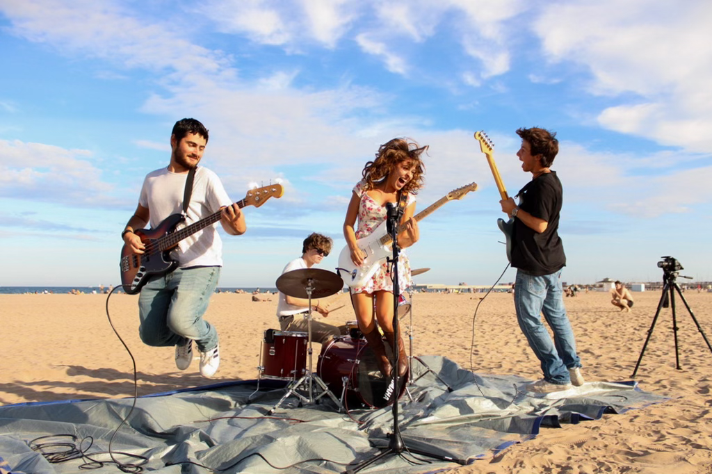 Jules Grace (center) and Berklee Valencia students jam out on a Spanish beach. (Courtesy Birdie Nelson)
