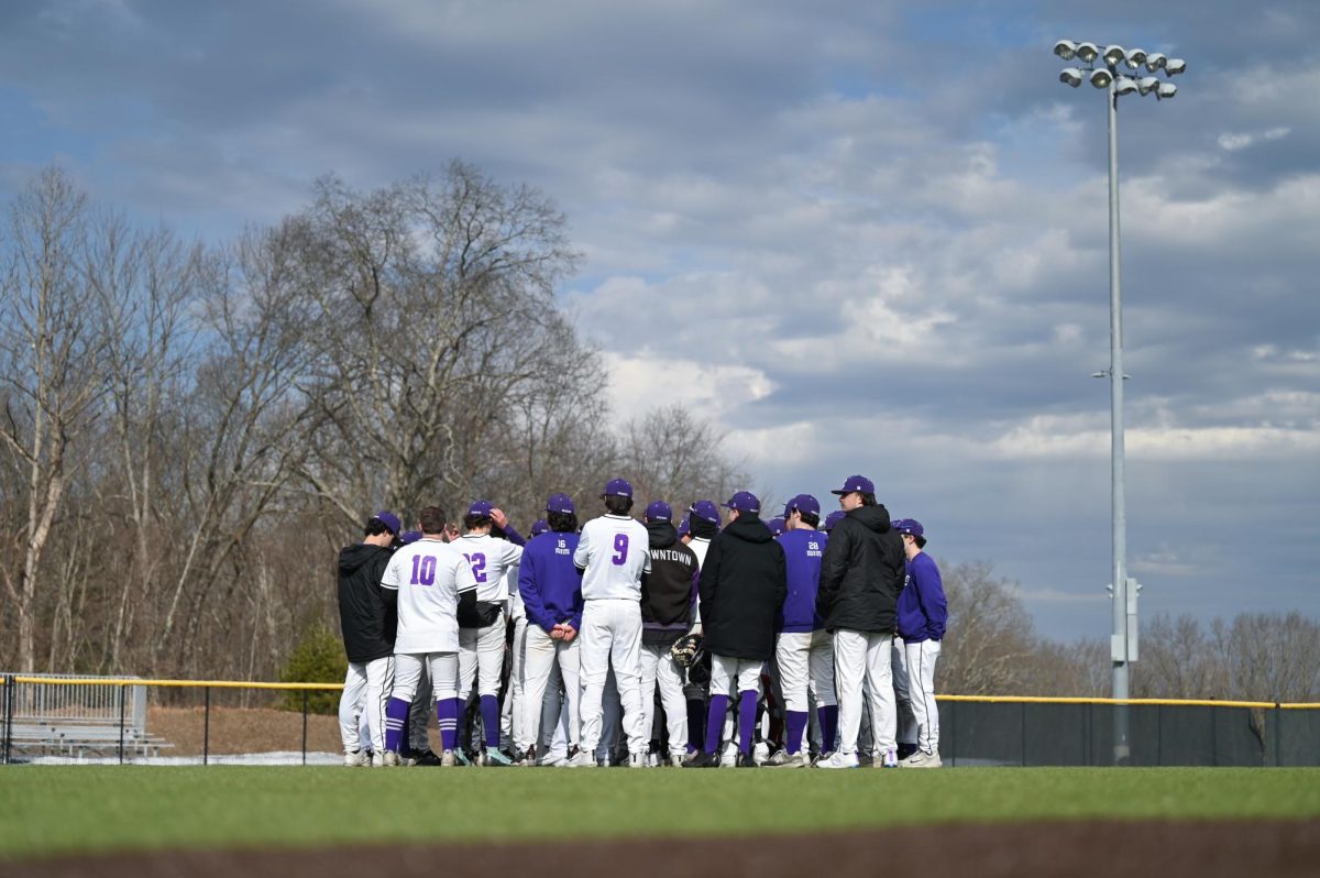 The Emerson baseball team huddles after their win over Colby-Sawyer College on March 1, 2025 (Courtesy of Anna Schoenmann).