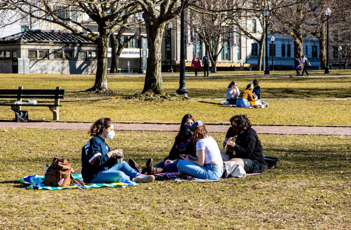 People sitting at a Boston park during the COVID-19 Pandemic. (Zhihao Wu/ Beacon archives)